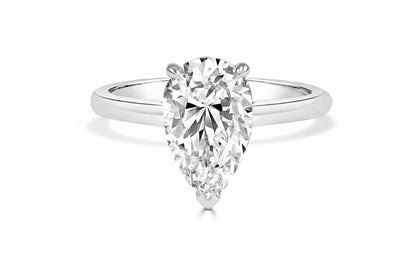 White Gold ring with a pear-shaped diamond on a white background
