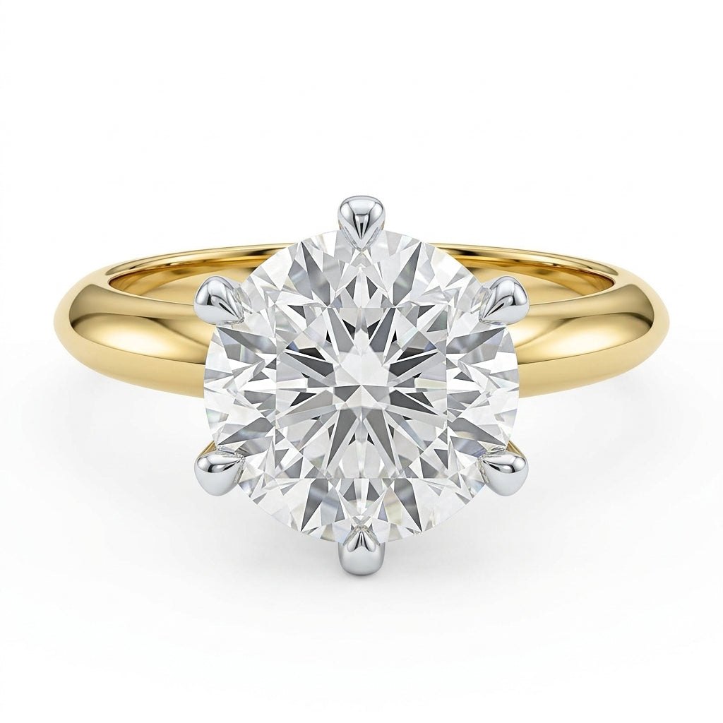 A classic solitaire engagement ring featuring a 3ct round brilliant-cut  lab diamond set in a six claw 14K white and yellow gold  band.