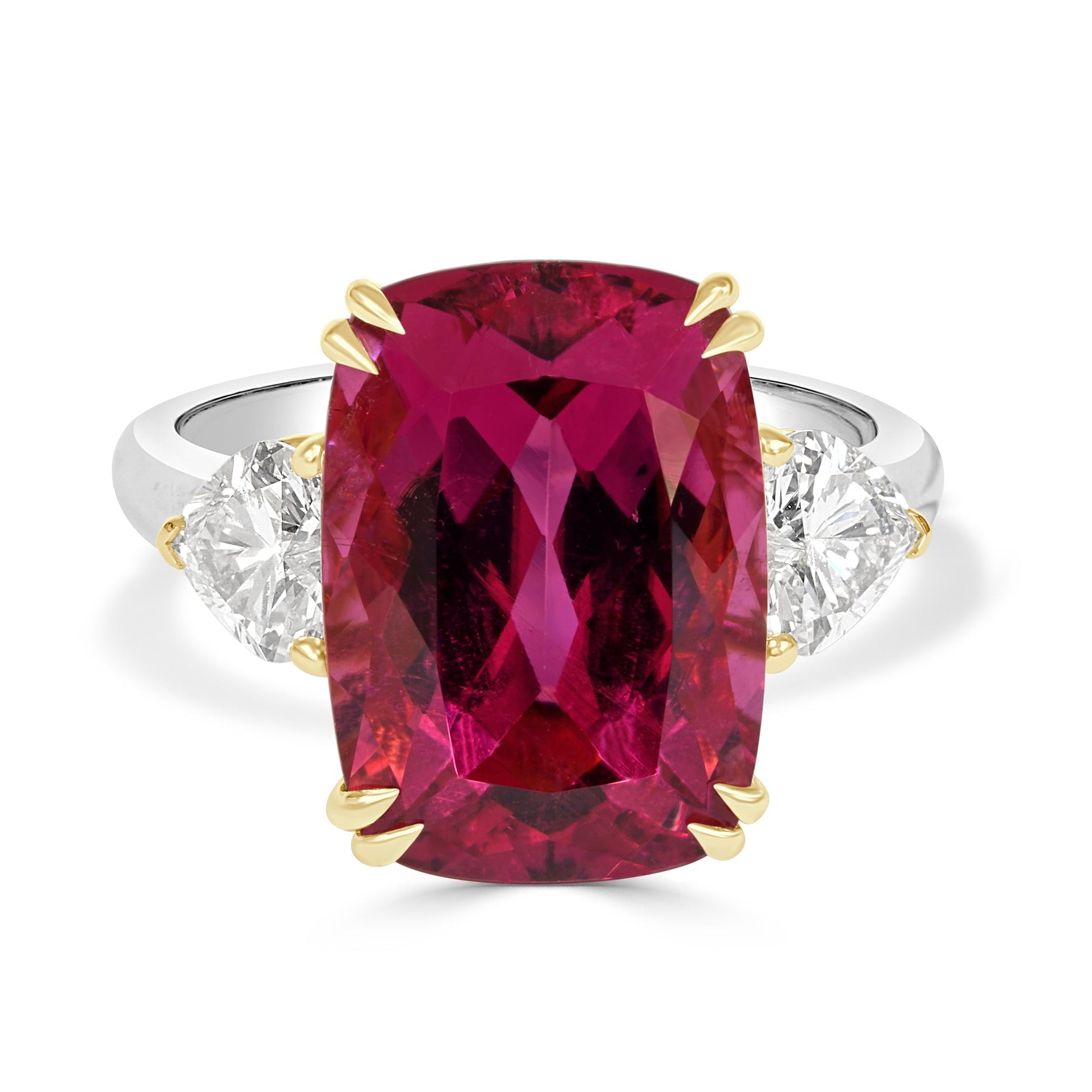 cushion cut rubelite and heart shaped diamond  trilogy on a white background