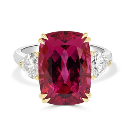 cushion cut rubelite and heart shaped diamond  trilogy on a white background